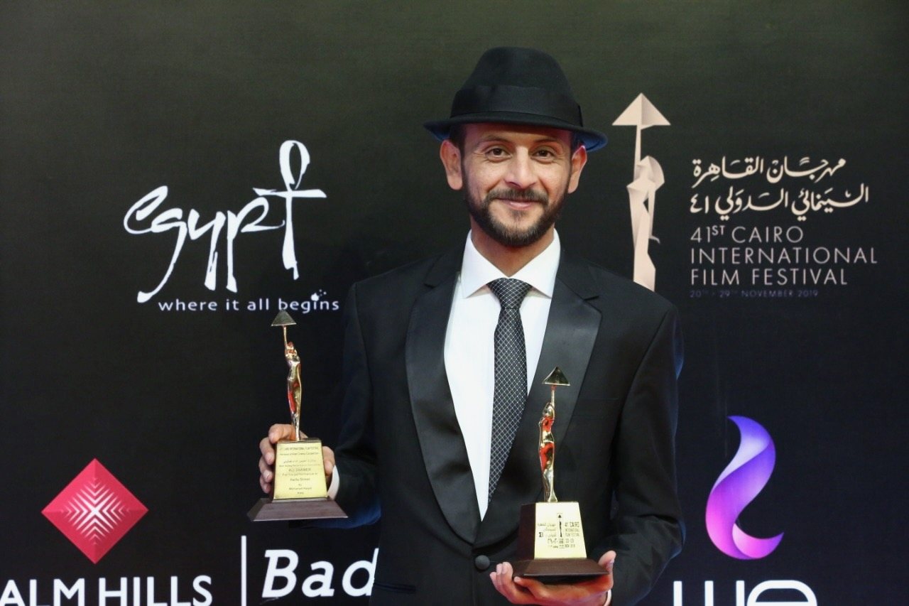 Mohanad Hayal holding the two awards Haifa Street won at the 41st Cairo International Film Festival, November 2019